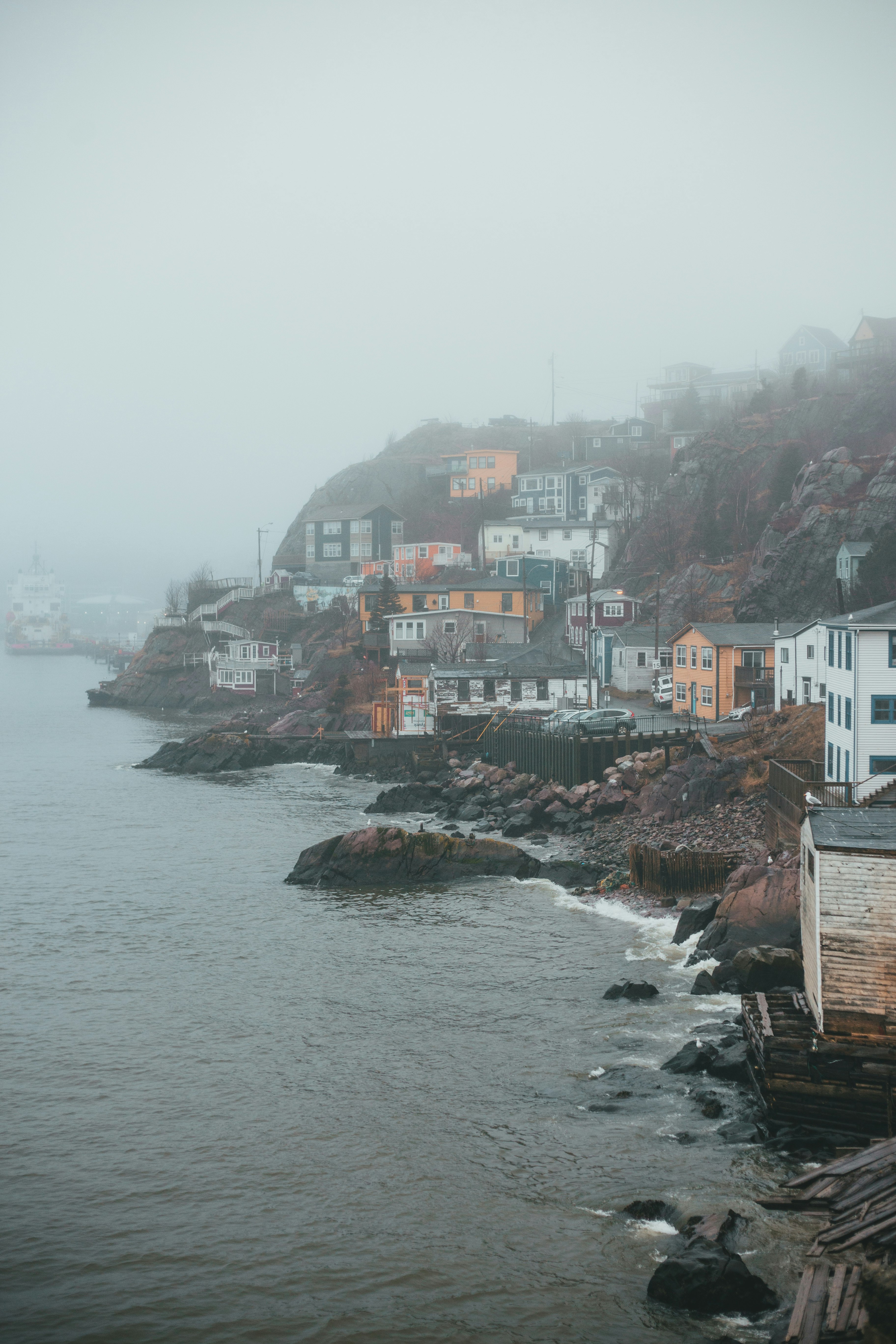 houses near body of water during daytime